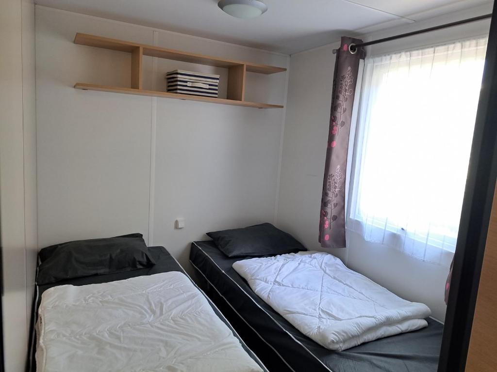 Postel nebo postele na pokoji v ubytování GH Vacances La Réserve