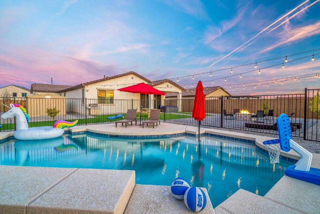 a swimming pool with a playground with a pool at Heated Pool King Bed Pool Table Ping Pong in Litchfield Park