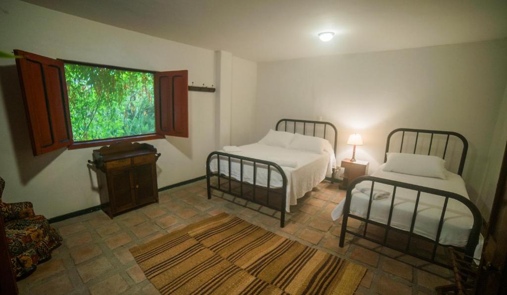 Postel nebo postele na pokoji v ubytování Finca La Argelia