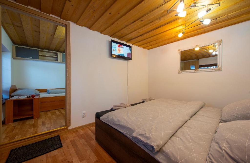 A bed or beds in a room at Wellness Vila Astra