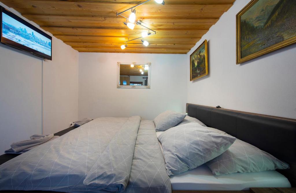 A bed or beds in a room at Wellness Vila Astra