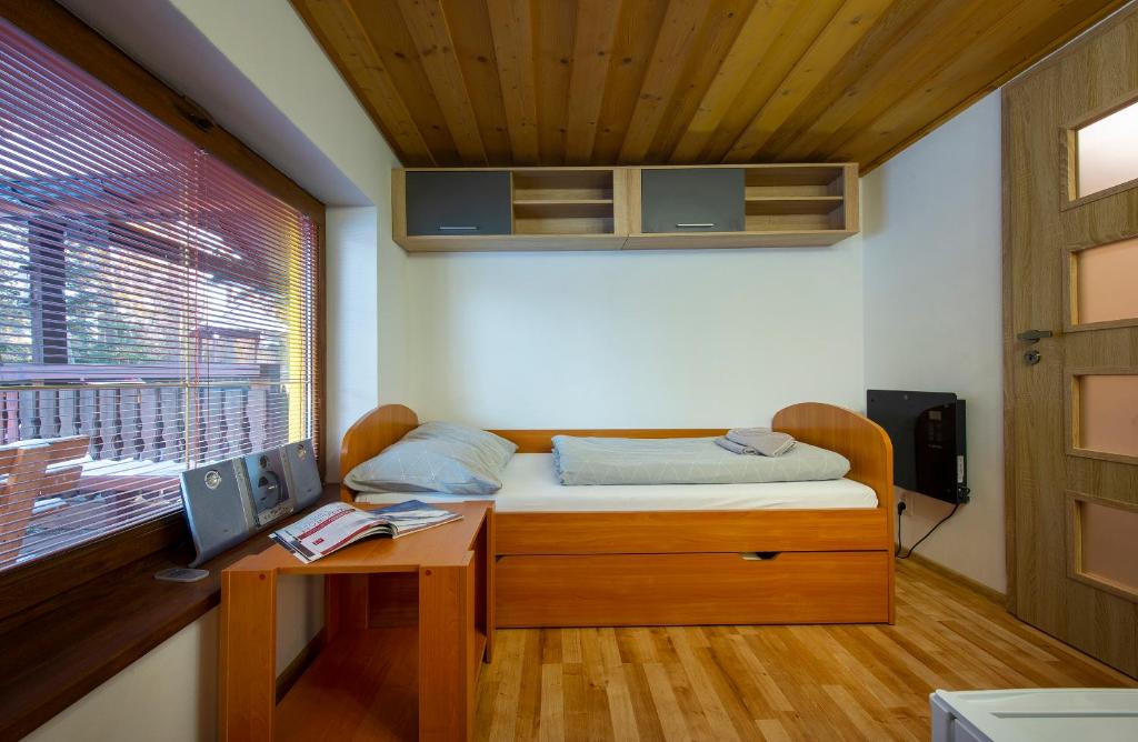 A bed or beds in a room at Wellness Vila Astra