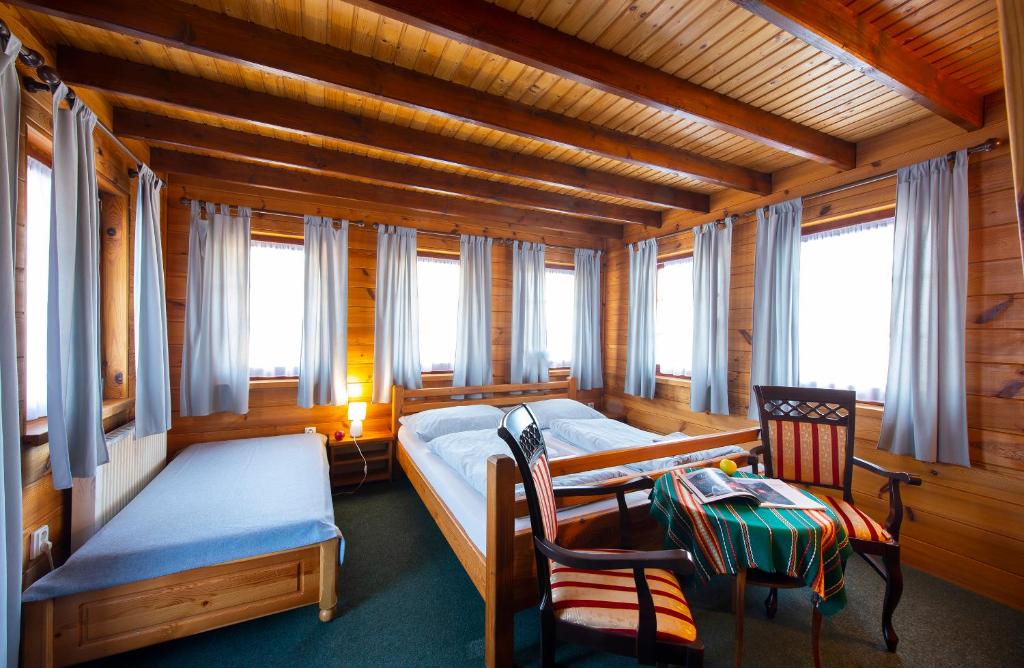 A bed or beds in a room at Wellness Vila Astra