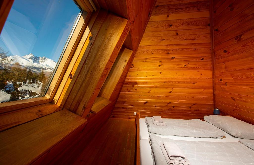 A bed or beds in a room at Wellness Vila Astra