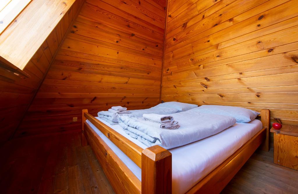 A bed or beds in a room at Wellness Vila Astra