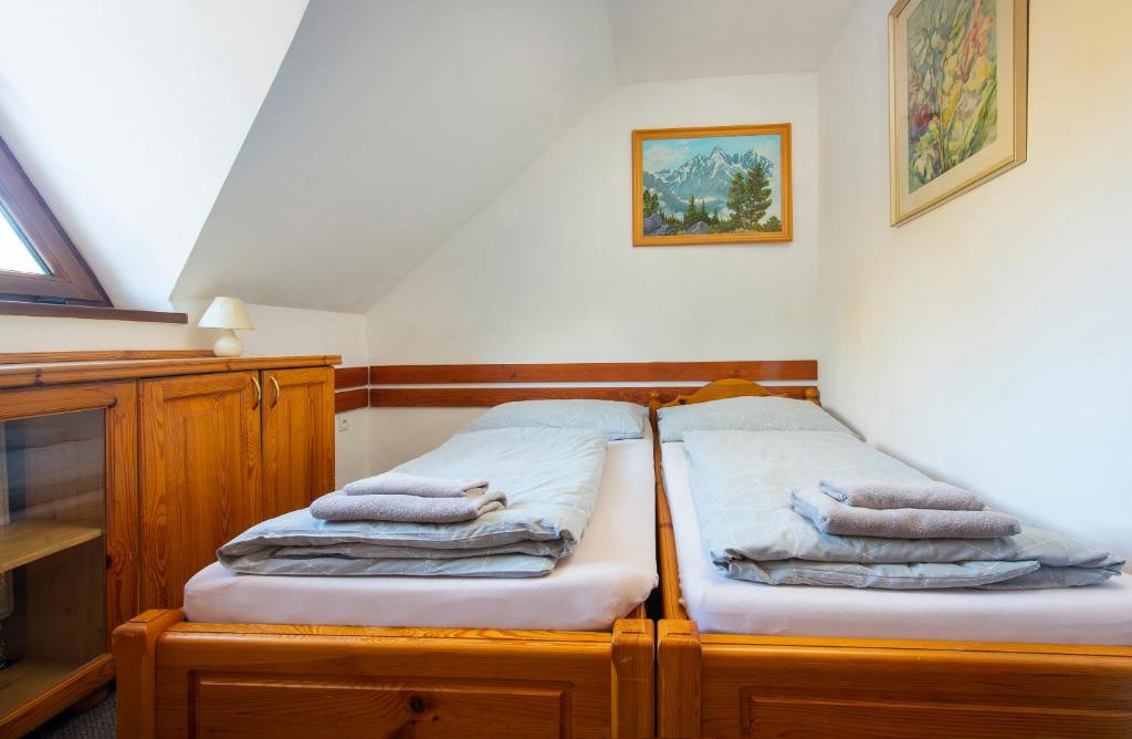 A bed or beds in a room at Wellness Vila Astra