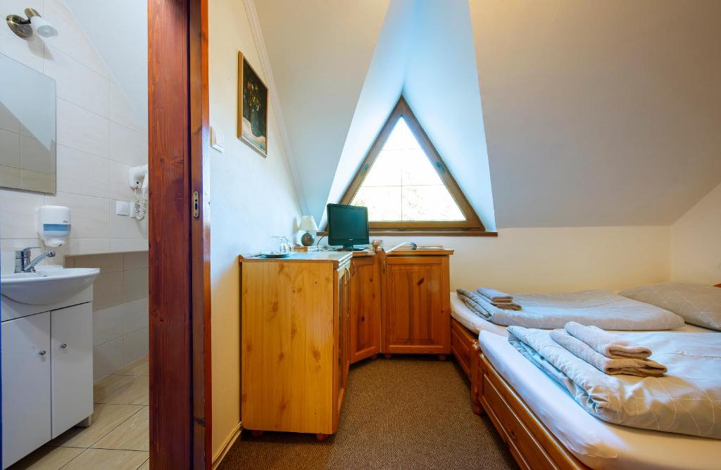 A bed or beds in a room at Wellness Vila Astra