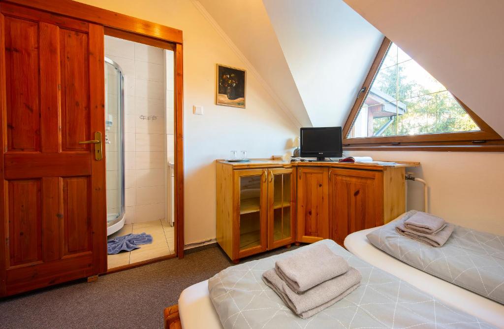 A bed or beds in a room at Wellness Vila Astra