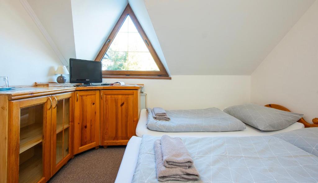 A bed or beds in a room at Wellness Vila Astra