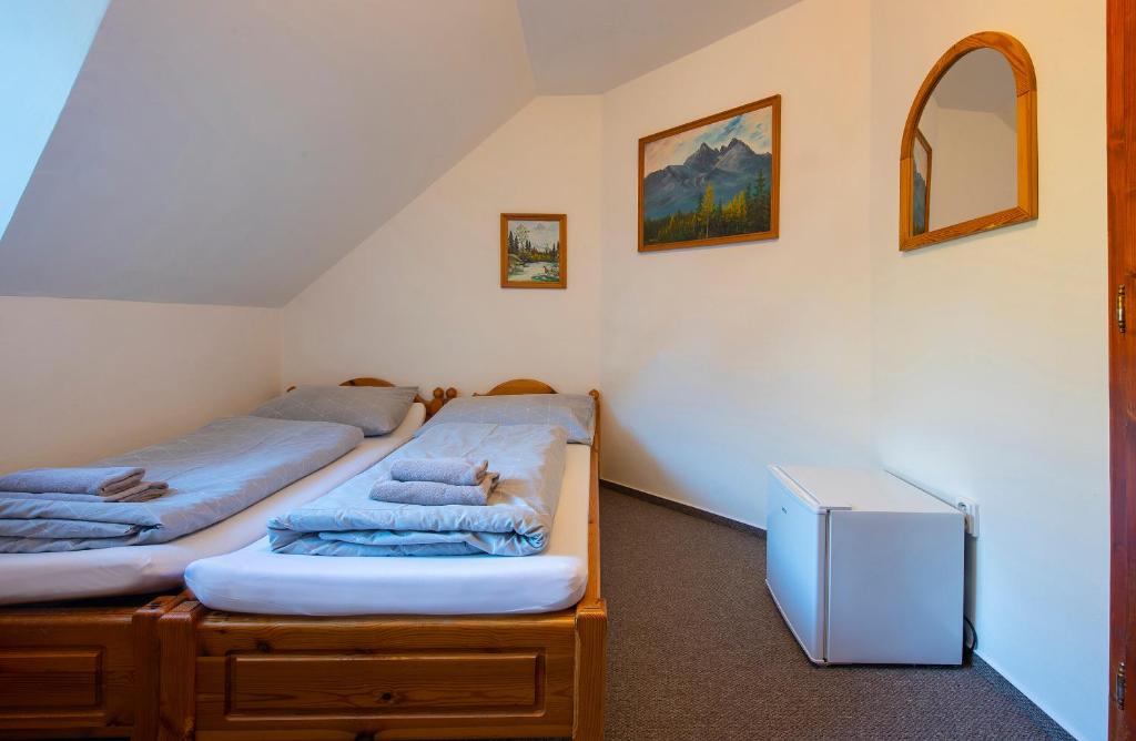A bed or beds in a room at Wellness Vila Astra