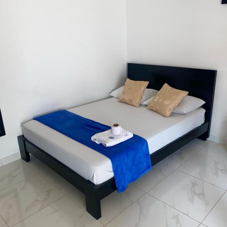 Postel nebo postele na pokoji v ubytování HOTEL LUZ MERY