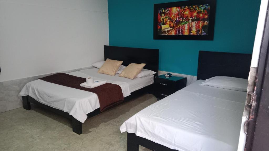 Postel nebo postele na pokoji v ubytování HOTEL LUZ MERY