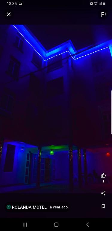 a room with blue and green lights on a building at Rolanda motel in Kampala