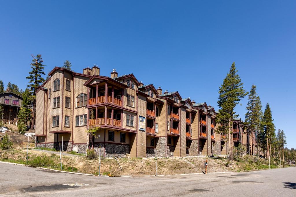 a large apartment building on the side of a street at Kirkwood Mountain Resort Properties in Kirkwood