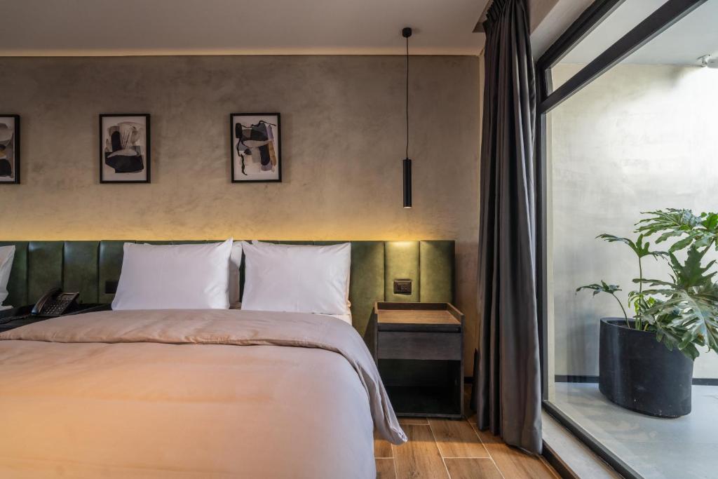 Una cama o camas en una habitación de ALCALÀ EXPO