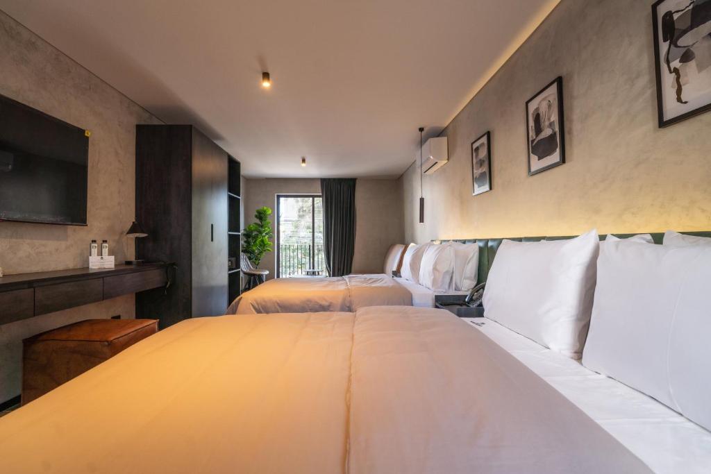 Una cama o camas en una habitación de ALCALÀ EXPO
