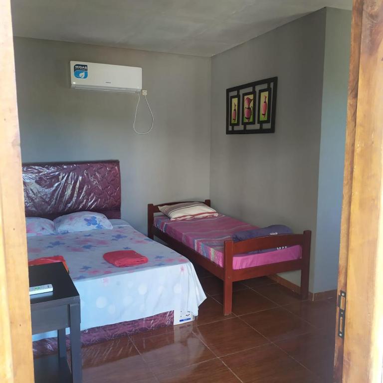Postel nebo postele na pokoji v ubytování HOSPEDAJE SAN JUAN
