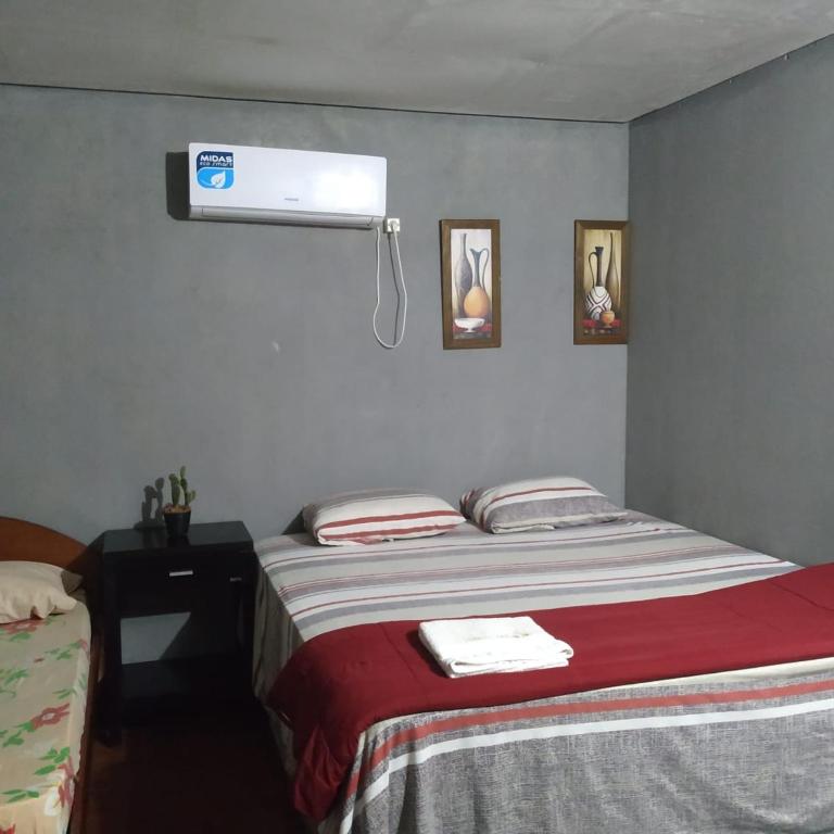 Postel nebo postele na pokoji v ubytování HOSPEDAJE SAN JUAN