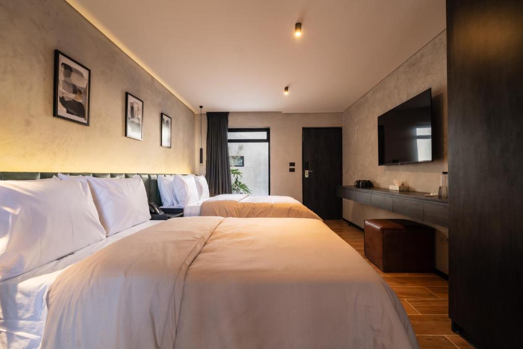 Una cama o camas en una habitación de ALCALÀ EXPO