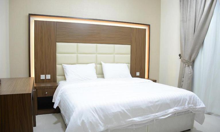 Ένα ή περισσότερα κρεβάτια σε δωμάτιο στο تراس للأجنحة الفندقية
