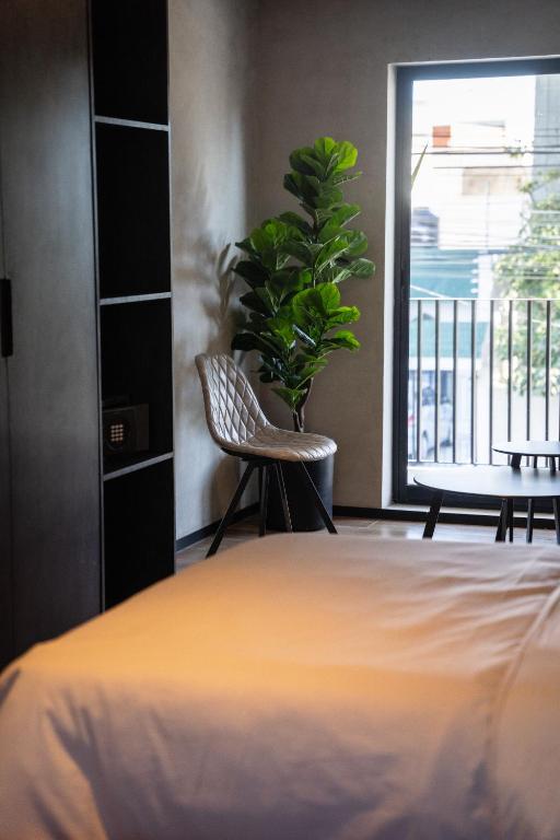 Una cama o camas en una habitación de ALCALÀ EXPO
