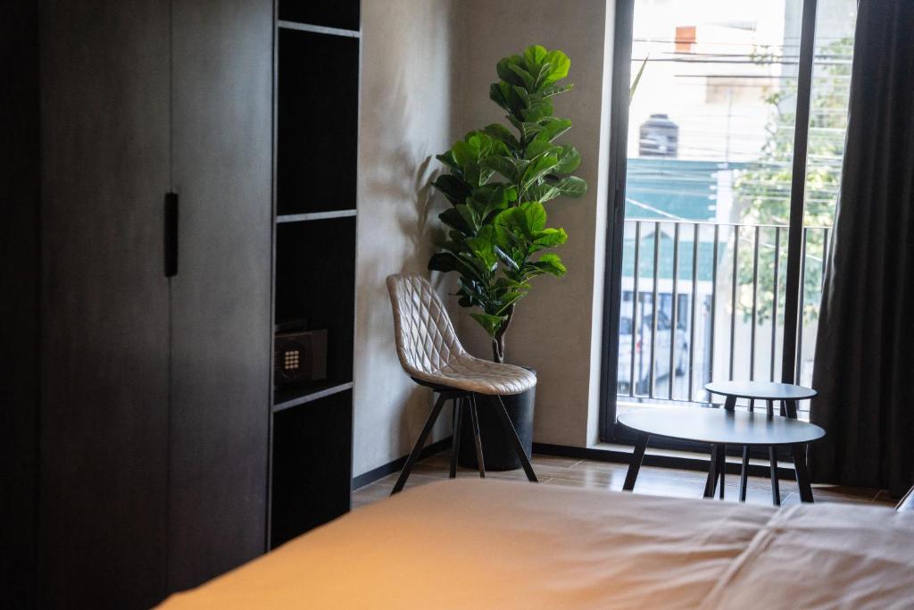 Una cama o camas en una habitación de ALCALÀ EXPO