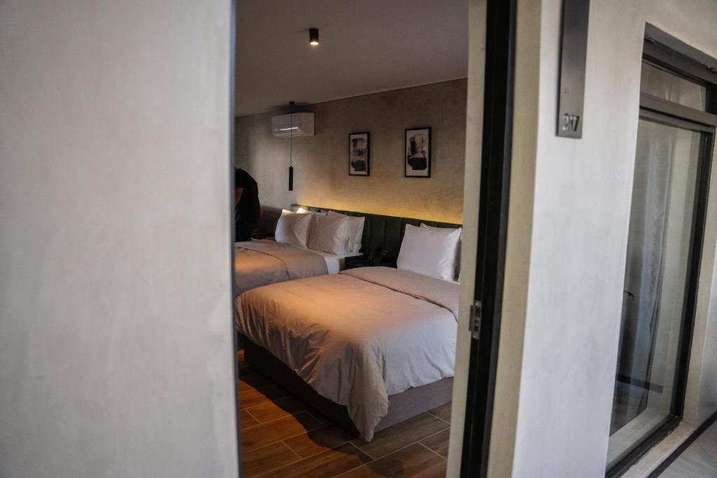 Una cama o camas en una habitación de ALCALÀ EXPO