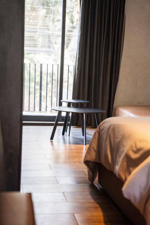 Una cama o camas en una habitación de ALCALÀ EXPO