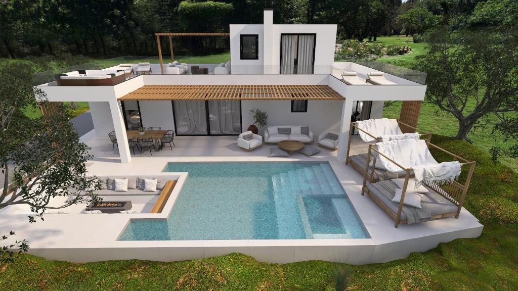 eine Villa mit einem Pool und einem Haus in der Unterkunft Villa Mourelo luxury villa in chania with private pool jacuzzi in Chania