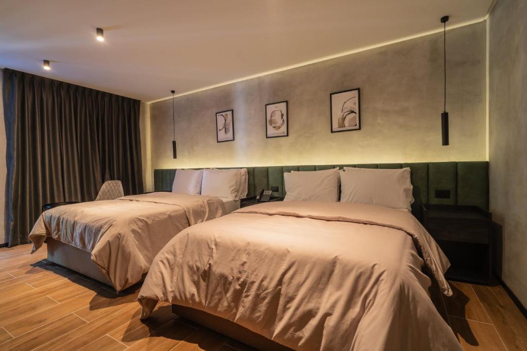 Una cama o camas en una habitación de ALCALÀ EXPO