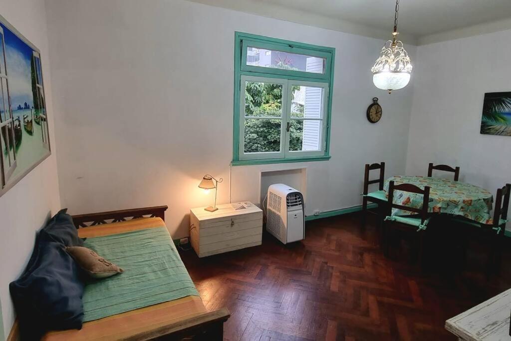 a living room with a bed and a window at Comfortable Apartment in Colegiales in Buenos Aires