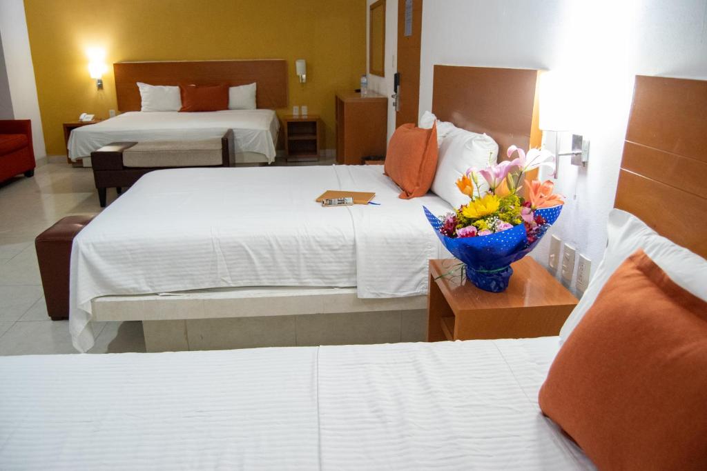 Postel nebo postele na pokoji v ubytování Hotel River Poliforum