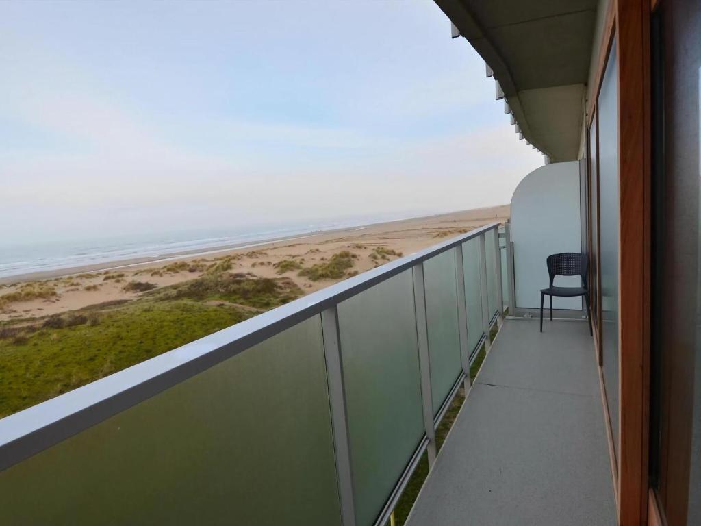 a balcony with a view of the beach at West31 with beautiful sea views in Oostduinkerke