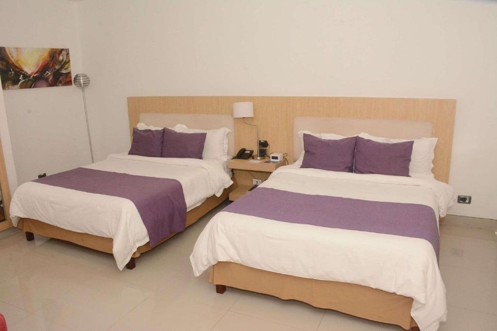 Tempat tidur dalam kamar di Radisson Diamond Barranquilla