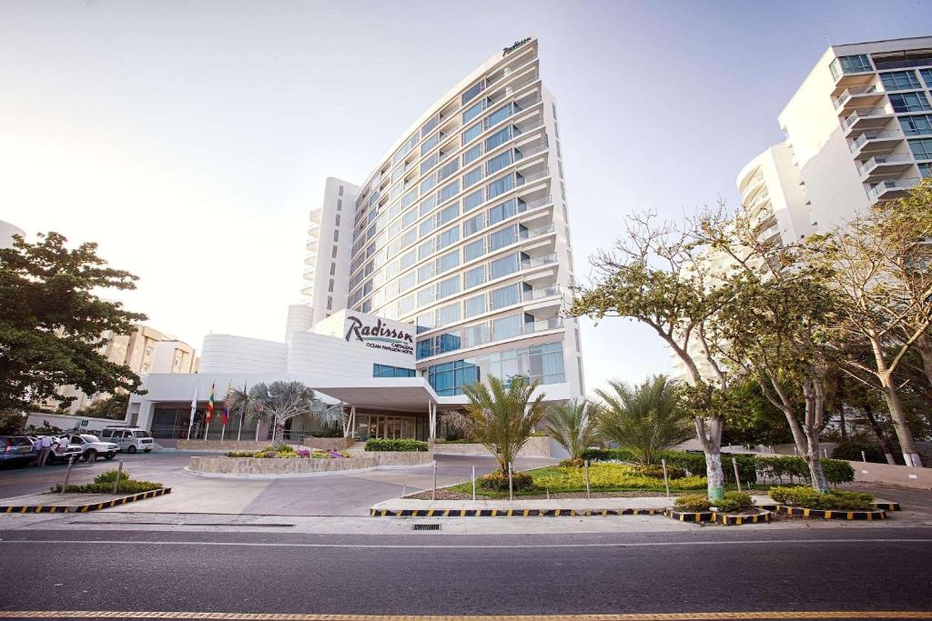 a tall building with a street in front of it at Radisson Cartagena Ocean Pavillion Hotel in Cartagena de Indias