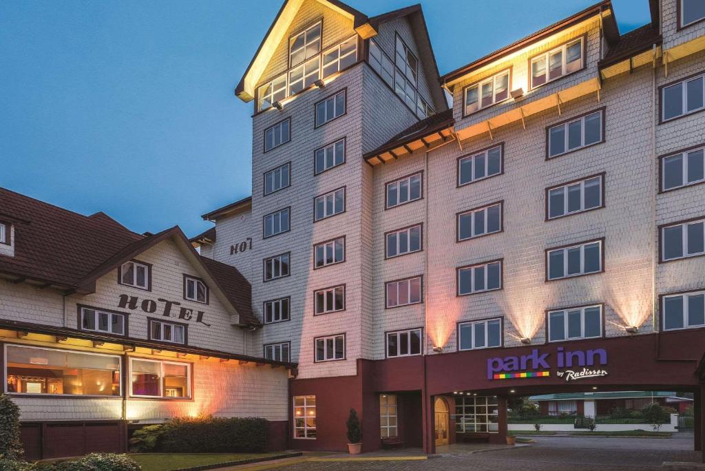 a hotel building with a park inn at Park Inn by Radisson Puerto Varas in Puerto Varas