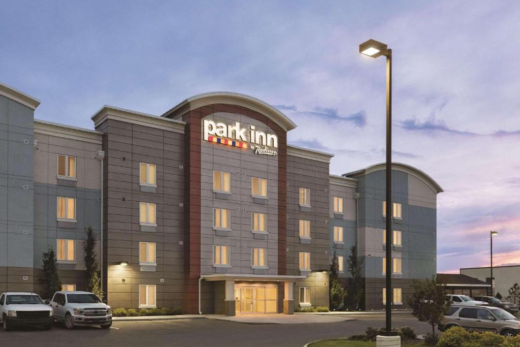 a parking lot in front of a hotel at Park Inn by Radisson, Calgary Airport North, AB in Calgary