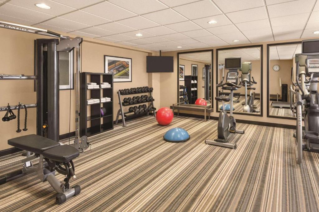 a gym with tread machines and a ball on the floor at Park Inn by Radisson, Calgary Airport North, AB in Calgary