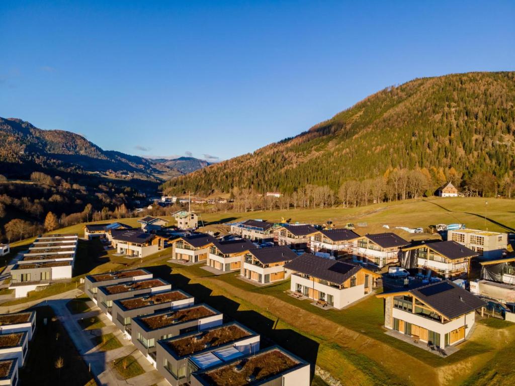 an aerial view of a resort with mountains in the background at Grebenzen Lodge Prinz in Sankt Lambrecht