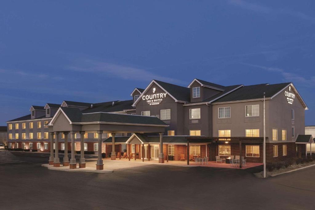 a large building with a lot of windows at Country Inn & Suites by Radisson, London, KY in London