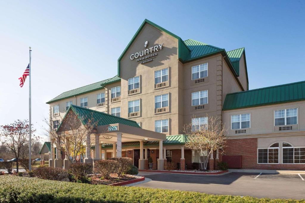 a rendering of a hotel with an american flag at Country Inn & Suites by Radisson, Lexington, KY in Lexington