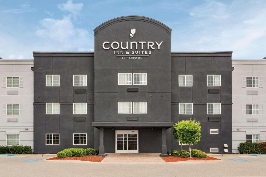 una representación de la parte delantera de una posada y suites del condado en Country Inn & Suites by Radisson, Shreveport-Airport, LA, en Shreveport