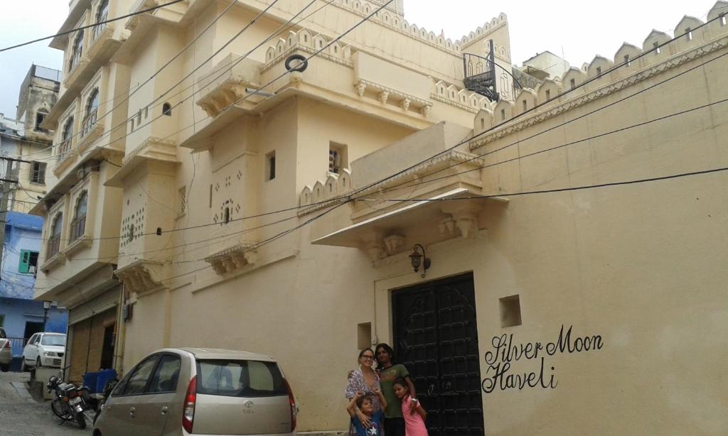 a group of people standing outside of a building at Silver Moon Haveli in Udaipur