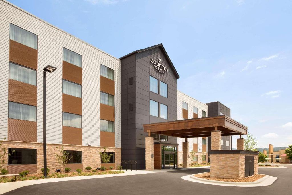a rendering of the front of a hotel at Country Inn & Suites by Radisson Asheville River Arts District in Asheville