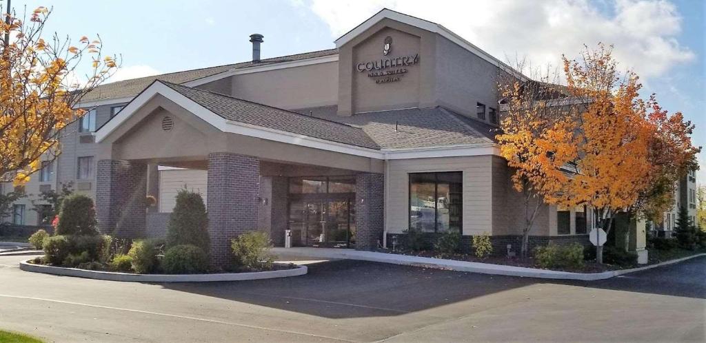 a store front of a building on a street at Country Inn & Suites by Radisson, Erie, PA in Erie