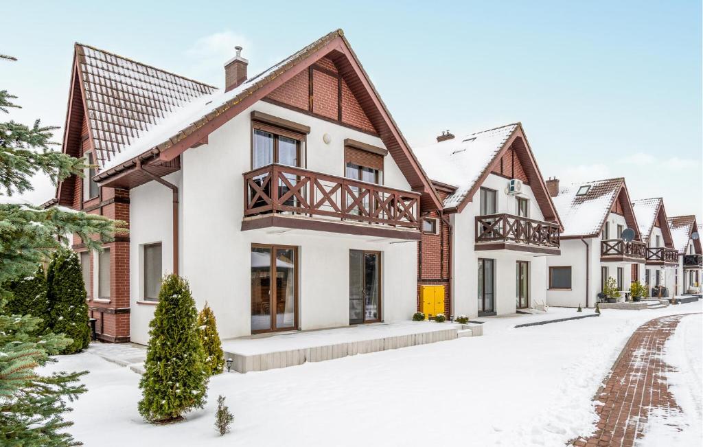 a house in the snow at Awesome Apartment In Zarnowska With Heated Swimming Pool in Żarnowska