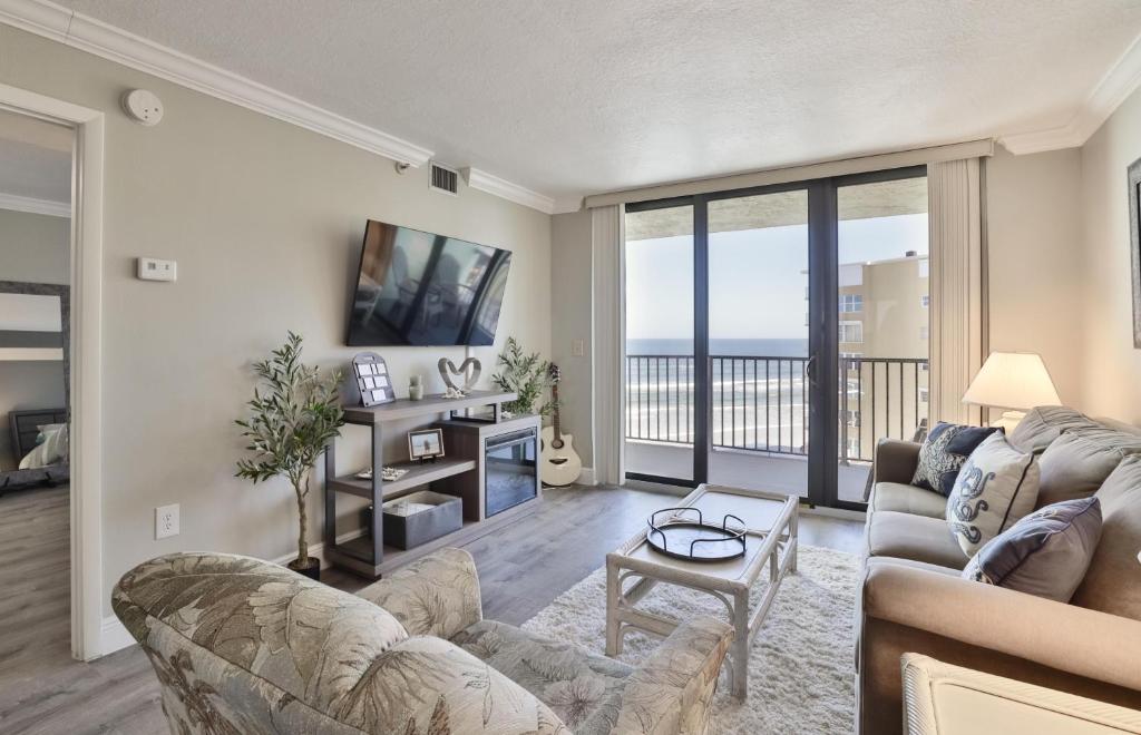 a living room with a view of the ocean at Ocean Trillium 601 A 1 Bedroom-1 Bath Ocean View Unit in New Smyrna Beach