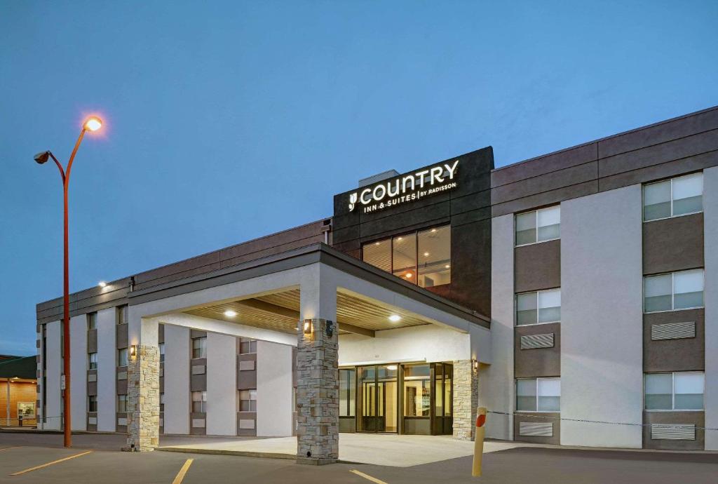 a rendering of the front of a hotel at Country Inn & Suites by Radisson, Pierre, SD in Pierre