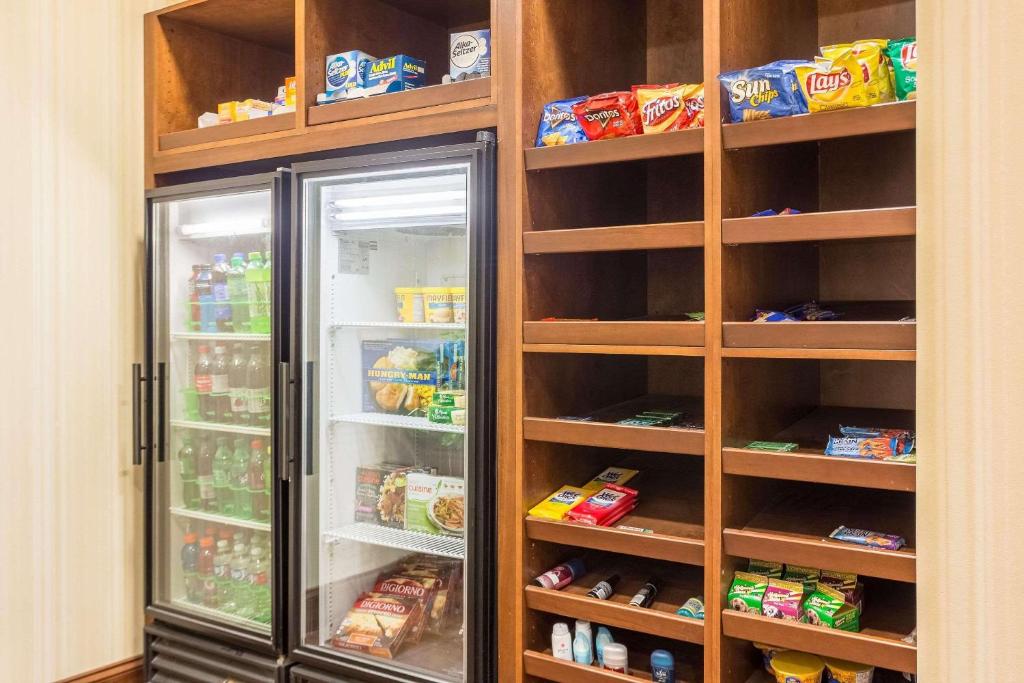 a refrigerator with its doors open in a kitchen at Country Inn & Suites by Radisson, Knoxville at Cedar Bluff, TN in Knoxville