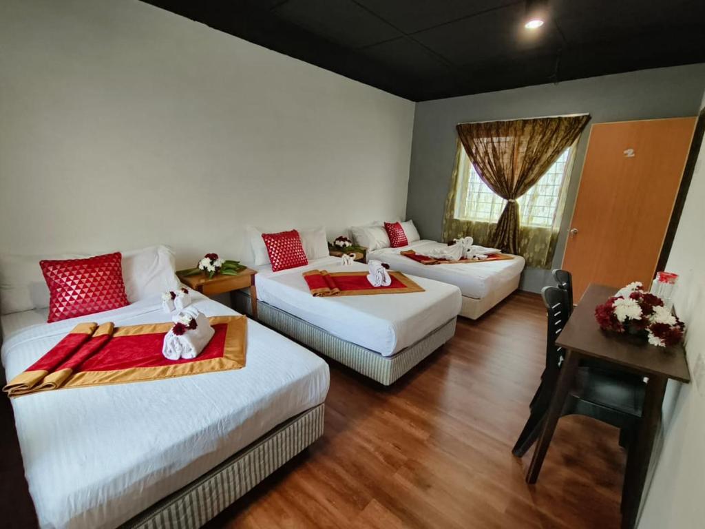 Postel nebo postele na pokoji v ubytování 1 Hati Homestay Sepang